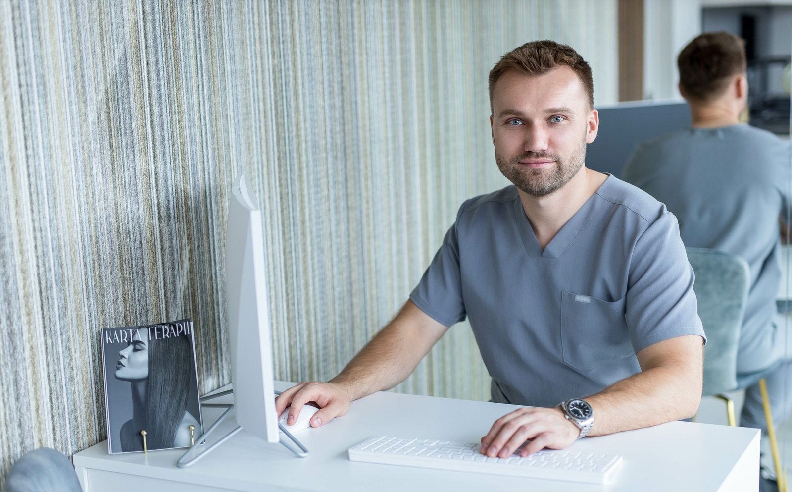 Dr Marcin Nylec during a consultation in his clinic in Katowice